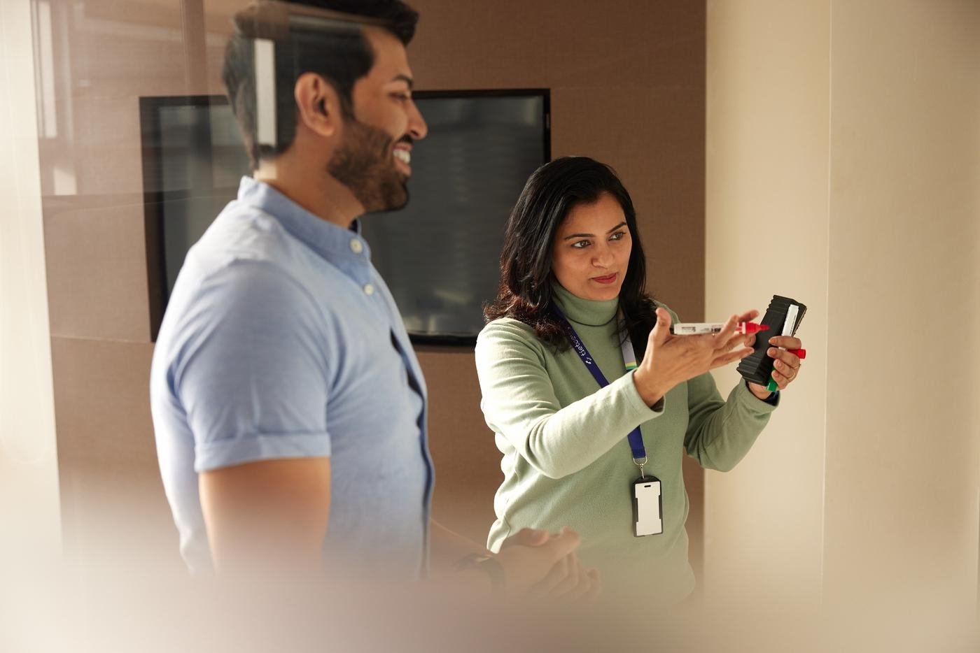 People meeting and working together using whiteboard