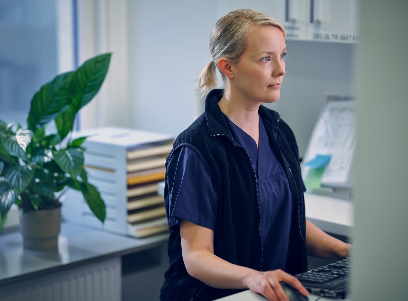 Lab medical specialist working on computer