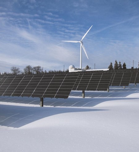 solar panels and wind turbine winter