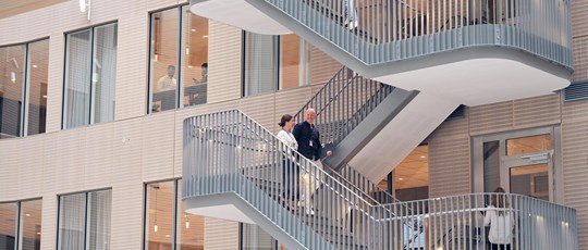 People walking the stairs in Tietoevry office