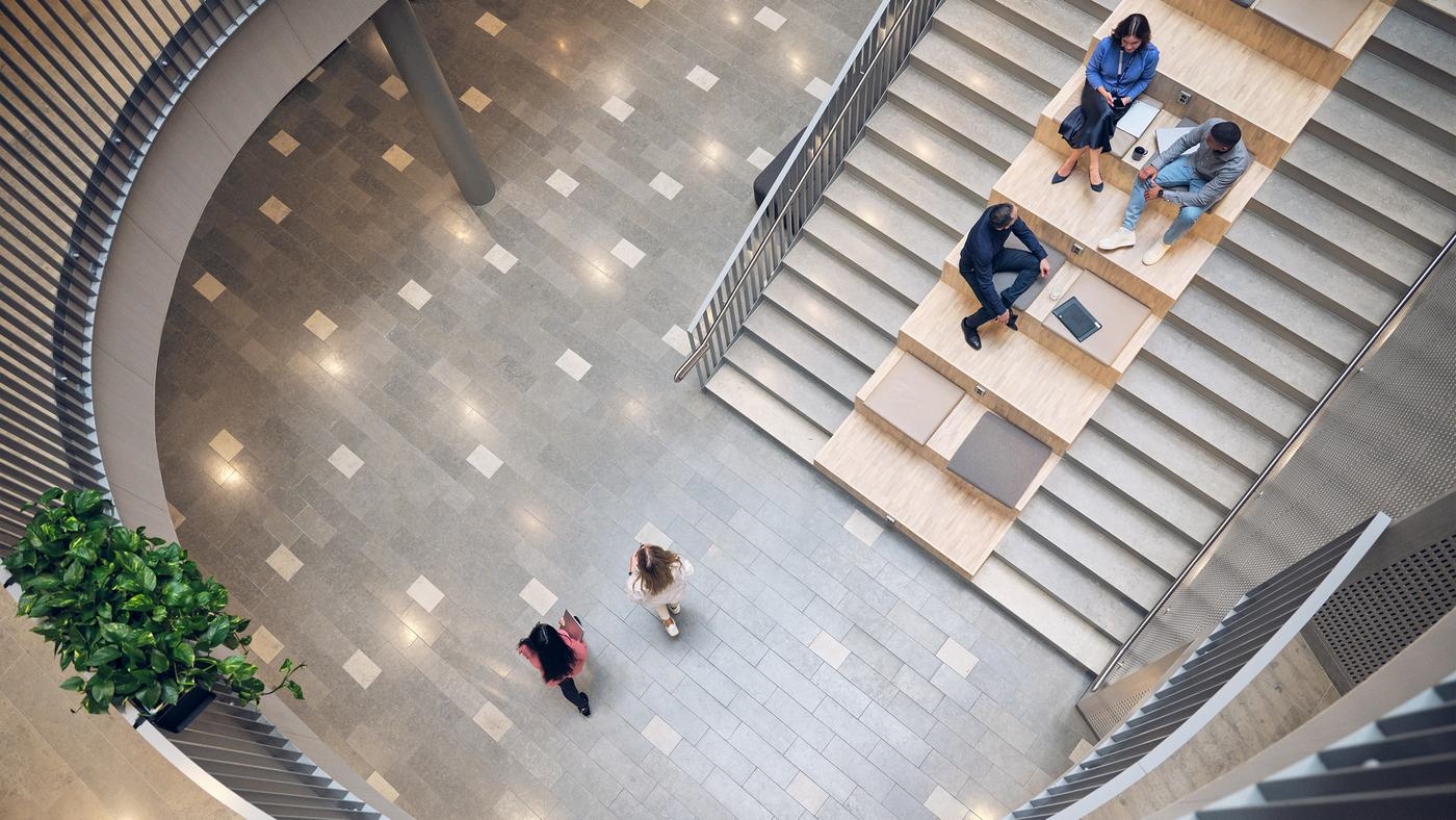 People meet on the stairs of Tietoevry office