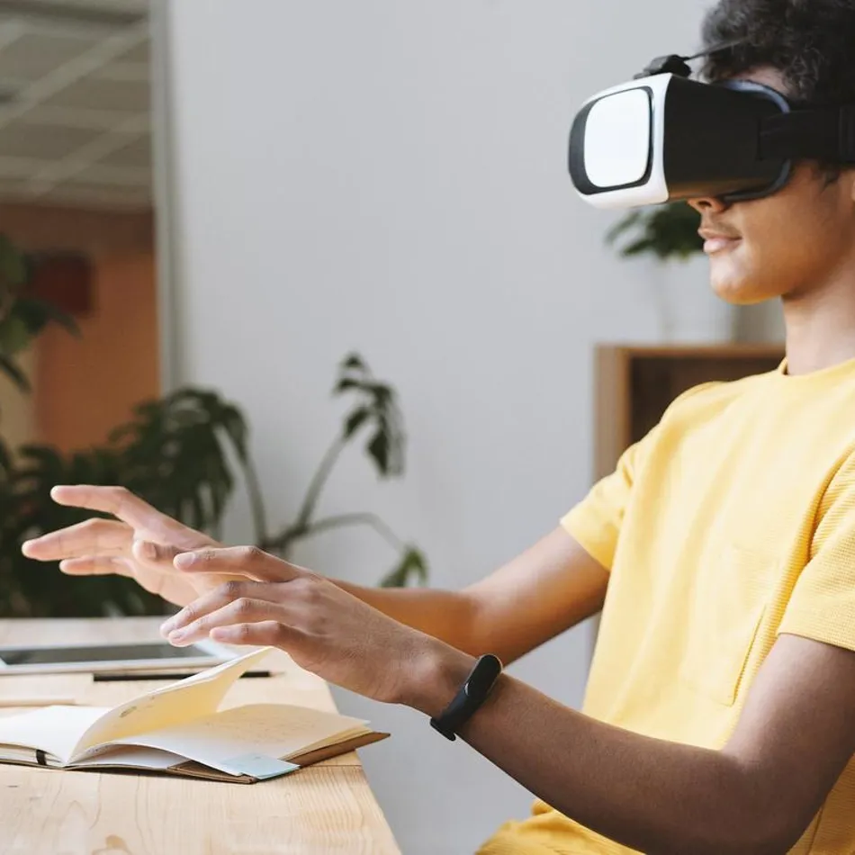 boy using a VR set to study at home